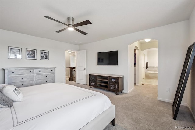 2234 S Nile St, Denver, CO 80228 - carpeted bedroom featuring arched walkways, ensuite bath, and ceiling fan