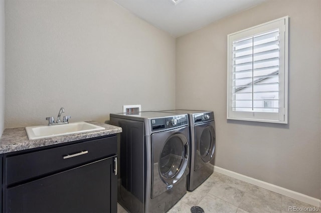 2234 S Nile St, Denver, CO 80228 - laundry room with washing machine and dryer, healthy amount of natural light, and light tile patterned flooring