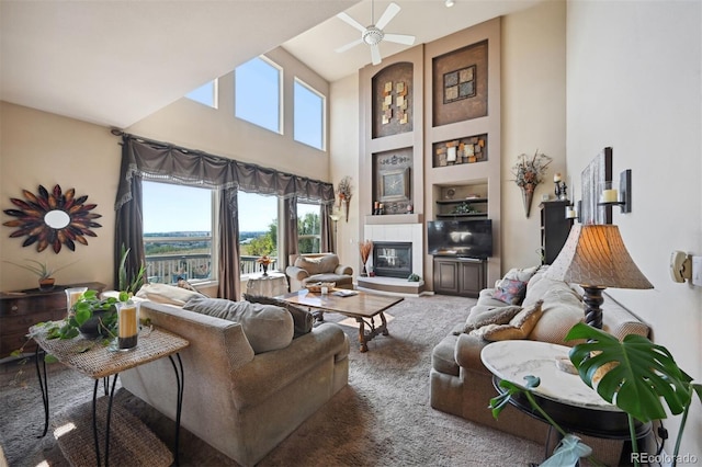 10520 W Vassar Dr, Lakewood, CO 80227 - living area with a towering ceiling, ceiling fan, and a fireplace