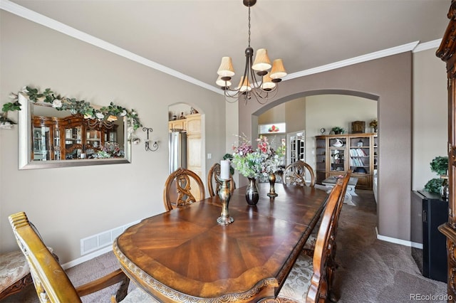 10520 W Vassar Dr, Lakewood, CO 80227 - carpeted dining space featuring arched walkways, a chandelier, crown molding, and baseboards