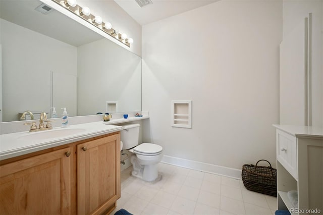 10520 W Vassar Dr, Lakewood, CO 80227 - bathroom with vanity, toilet, and baseboards