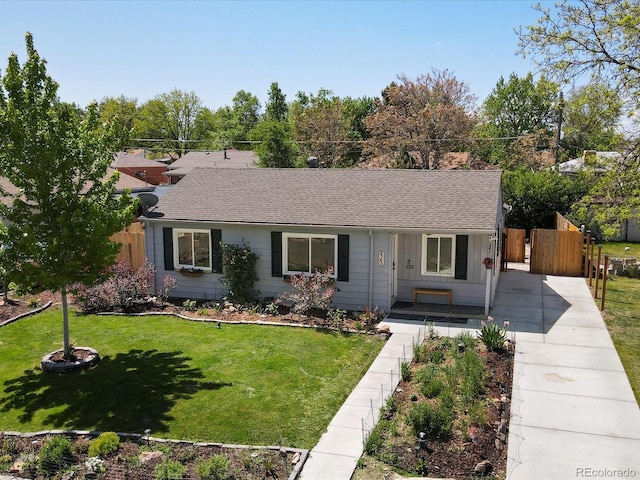 4740 W Wyoming Pl, Denver, CO 80219 - ranch-style house featuring driveway, a shingled roof, and a porch