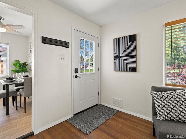 4740 W Wyoming Pl, Denver, CO 80219 - entrance foyer with wood finished floors, healthy amount of natural light, and baseboards