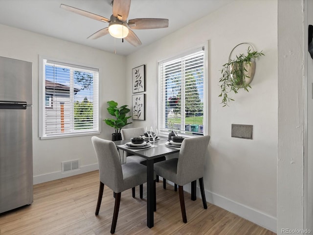 4740 W Wyoming Pl, Denver, CO 80219 - dining area with a ceiling fan, light wood finished floors, and baseboards
