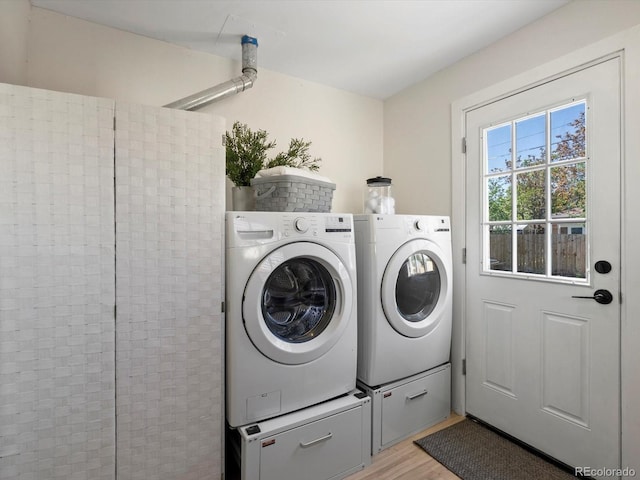 4740 W Wyoming Pl, Denver, CO 80219 - laundry area featuring washing machine and clothes dryer and light wood-style floors