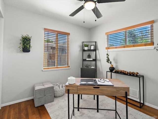 4740 W Wyoming Pl, Denver, CO 80219 - home office featuring wood finished floors, healthy amount of natural light, and baseboards