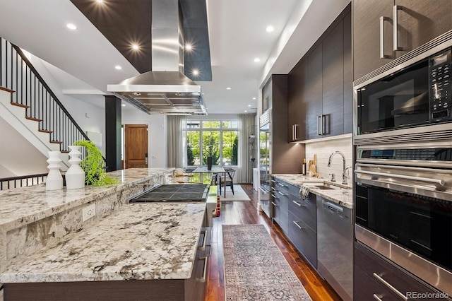 370 Garfield St, Denver, CO 80206 - kitchen with stainless steel appliances, island exhaust hood, dark wood-type flooring, modern cabinets, and light stone countertops