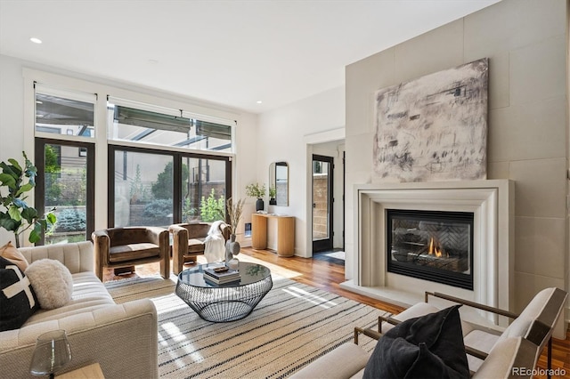 370 Garfield St, Denver, CO 80206 - living area featuring wood finished floors, a glass covered fireplace, and recessed lighting