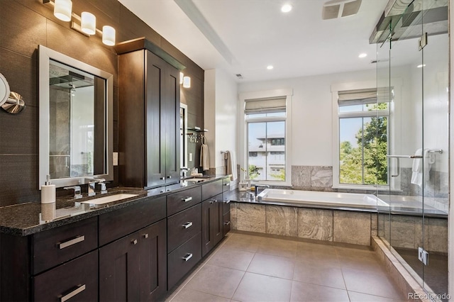 370 Garfield St, Denver, CO 80206 - bathroom with double vanity, a garden tub, tile patterned floors, recessed lighting, and an enclosed shower