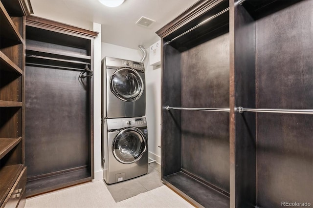 370 Garfield St, Denver, CO 80206 - laundry room featuring estacked washer and dryer and tile patterned flooring