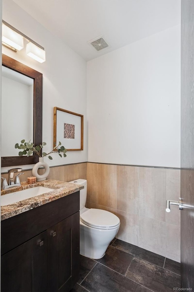 370 Garfield St, Denver, CO 80206 - bathroom with vanity and wainscoting
