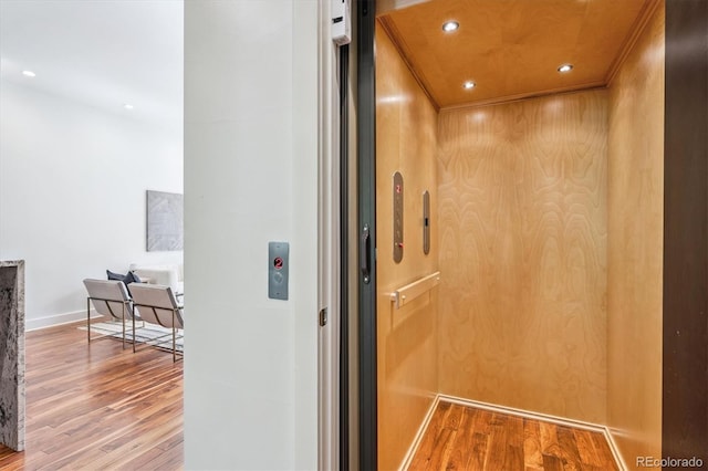 370 Garfield St, Denver, CO 80206 - elevator featuring wood finished floors, crown molding, and recessed lighting