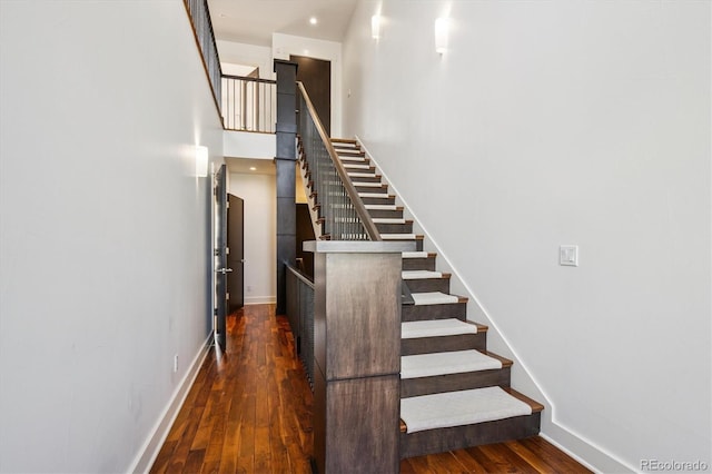 370 Garfield St, Denver, CO 80206 - stairs featuring hardwood / wood-style flooring and baseboards