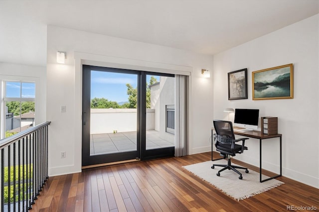 370 Garfield St, Denver, CO 80206 - home office with healthy amount of natural light and hardwood / wood-style floors