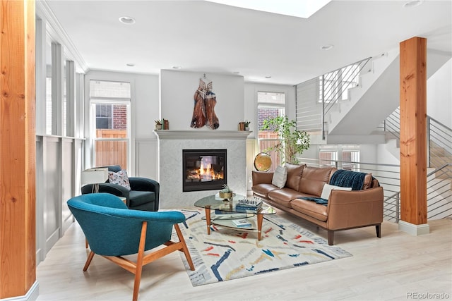 501 S Race St, Denver, CO 80209 - living area featuring wood finished floors, plenty of natural light, a high end fireplace, stairs, and recessed lighting