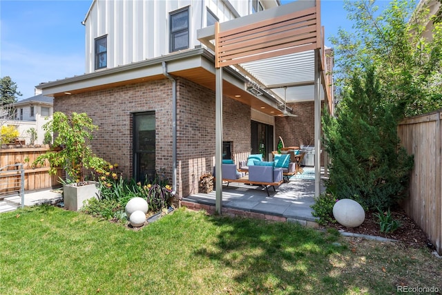 501 S Race St, Denver, CO 80209 - back of property featuring a patio, brick siding, a pergola, outdoor lounge area, and board and batten siding