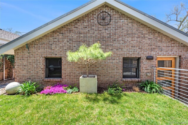 501 S Race St, Denver, CO 80209 - view of side of property with brick siding and a yard