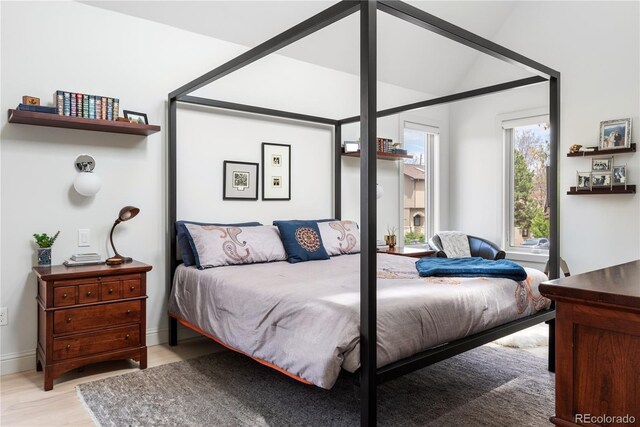 501 S Race St, Denver, CO 80209 - bedroom featuring light wood-style flooring, vaulted ceiling, and baseboards
