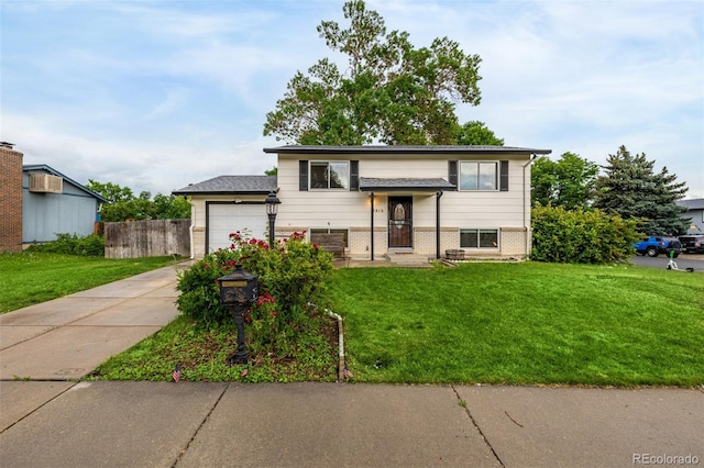 7912 Fenton St, Arvada, CO 80003 - bi-level home with driveway, a garage, and brick siding