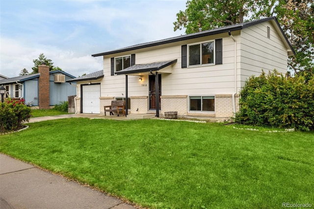 7912 Fenton St, Arvada, CO 80003 - bi-level home featuring brick siding, a front lawn, driveway, and an attached garage