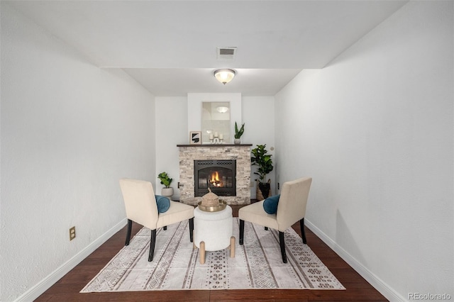 7912 Fenton St, Arvada, CO 80003 - sitting room featuring a stone fireplace and wood finished floors