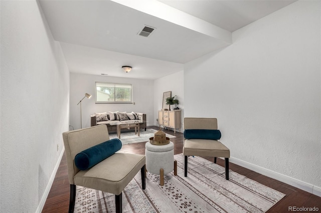 7912 Fenton St, Arvada, CO 80003 - sitting room with wood finished floors and a textured wall
