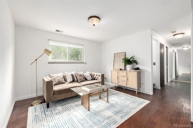 7912 Fenton St, Arvada, CO 80003 - living area featuring dark wood-style flooring and baseboards