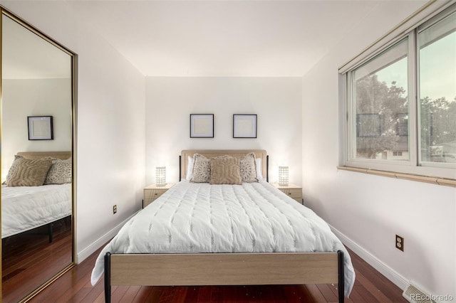 7912 Fenton St, Arvada, CO 80003 - bedroom with baseboards and dark wood-style floors