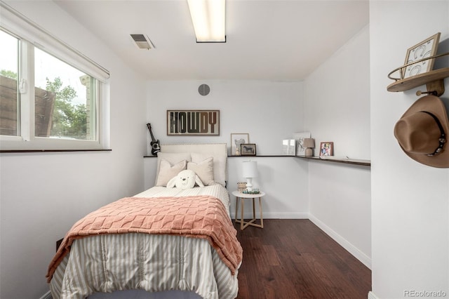 7912 Fenton St, Arvada, CO 80003 - bedroom featuring wood finished floors and baseboards