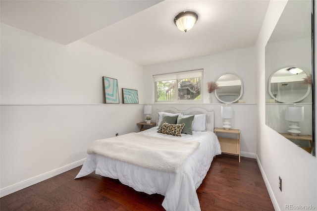7912 Fenton St, Arvada, CO 80003 - bedroom with baseboards and wood finished floors