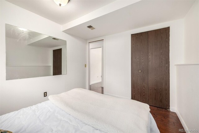 7912 Fenton St, Arvada, CO 80003 - bedroom with dark wood-type flooring and baseboards