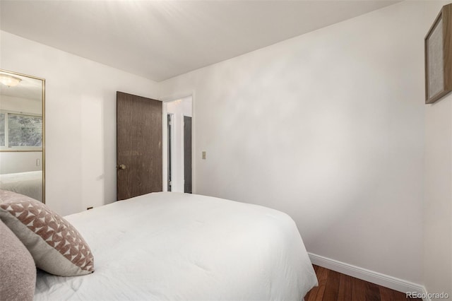 7912 Fenton St, Arvada, CO 80003 - bedroom featuring baseboards and wood finished floors