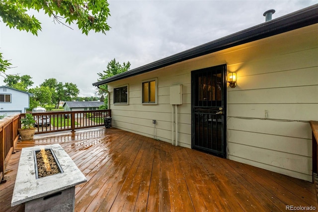7912 Fenton St, Arvada, CO 80003 - wooden deck featuring an outdoor fire pit