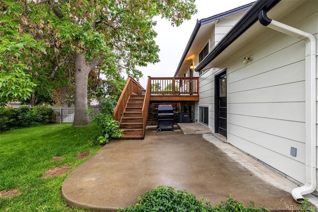 7912 Fenton St, Arvada, CO 80003 - view of patio / terrace with stairs, a wooden deck, and area for grilling
