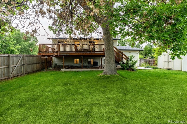 7912 Fenton St, Arvada, CO 80003 - rear view of house with stairway, a deck, a fenced backyard, and a shed