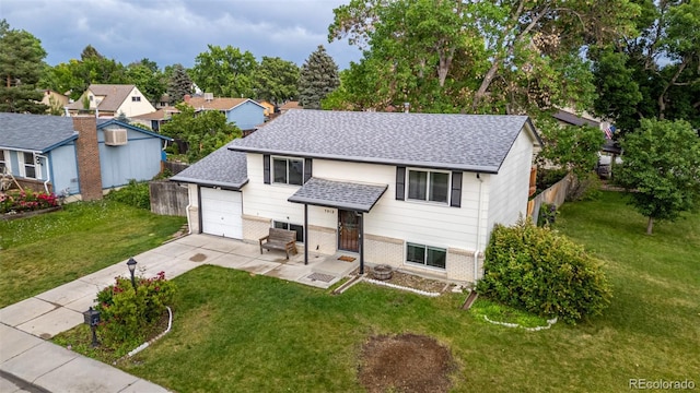 7912 Fenton St, Arvada, CO 80003 - view of front facade with roof with shingles, concrete driveway, and brick siding