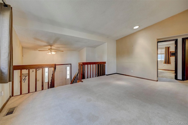 4738 Dover Dr, Colorado Springs, CO 80916 - carpeted spare room featuring a textured ceiling, ceiling fan, recessed lighting, and vaulted ceiling