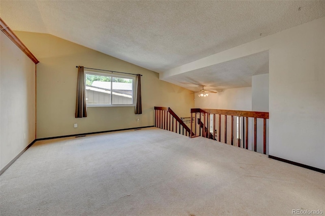 4738 Dover Dr, Colorado Springs, CO 80916 - carpeted spare room featuring lofted ceiling, ceiling fan, and a textured ceiling