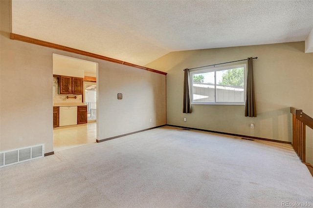 4738 Dover Dr, Colorado Springs, CO 80916 - unfurnished room with light colored carpet, vaulted ceiling, and a textured ceiling
