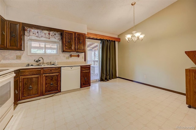 4738 Dover Dr, Colorado Springs, CO 80916 - kitchen with white appliances, vaulted ceiling, a chandelier, light countertops, and light flooring