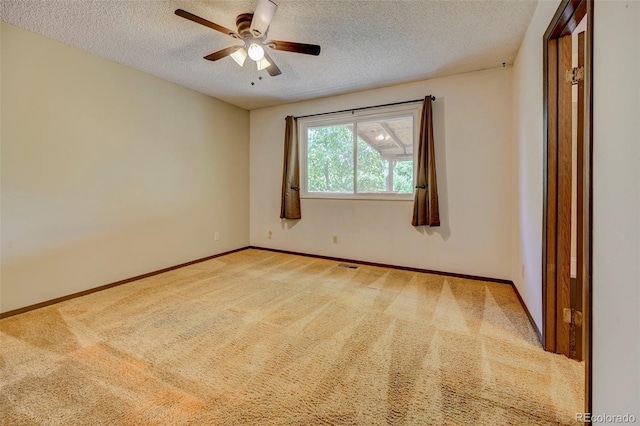4738 Dover Dr, Colorado Springs, CO 80916 - spare room featuring a textured ceiling, a ceiling fan, and light colored carpet