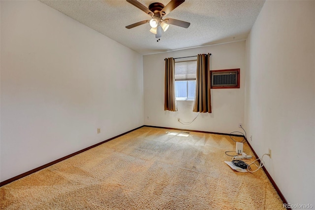 4738 Dover Dr, Colorado Springs, CO 80916 - carpeted empty room featuring a textured ceiling, ceiling fan, and a wall unit AC