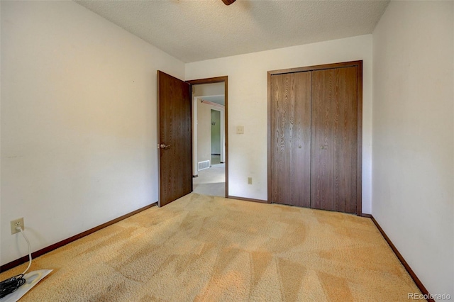 4738 Dover Dr, Colorado Springs, CO 80916 - unfurnished bedroom featuring carpet, a closet, and a textured ceiling