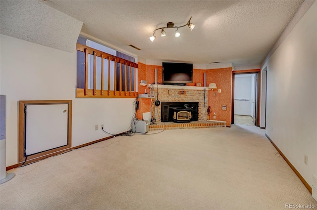 4738 Dover Dr, Colorado Springs, CO 80916 - unfurnished living room with carpet flooring, a textured ceiling, and a brick fireplace
