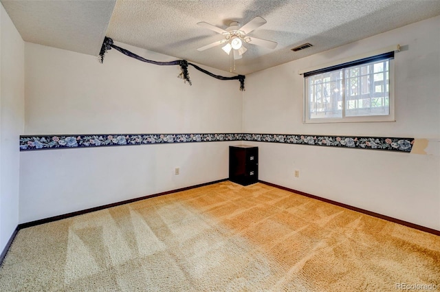 4738 Dover Dr, Colorado Springs, CO 80916 - unfurnished room with carpet, a ceiling fan, and a textured ceiling