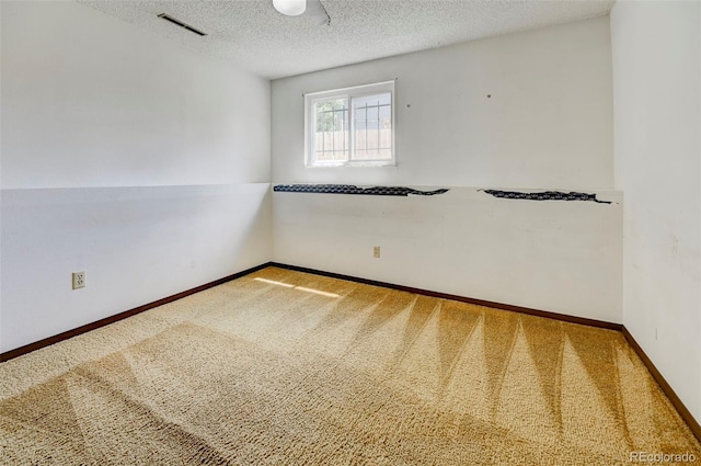 4738 Dover Dr, Colorado Springs, CO 80916 - spare room featuring carpet flooring and a textured ceiling
