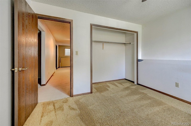 4738 Dover Dr, Colorado Springs, CO 80916 - unfurnished bedroom featuring carpet, a closet, and a textured ceiling