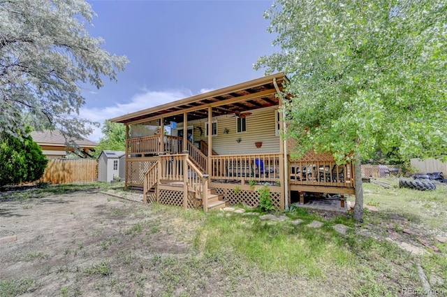 4738 Dover Dr, Colorado Springs, CO 80916 - view of front facade featuring a storage shed and a deck
