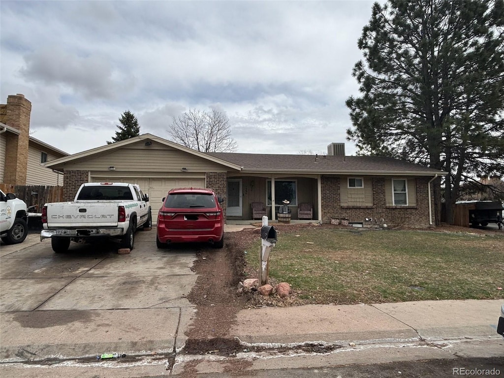 ranch-style house with a front lawn and a garage