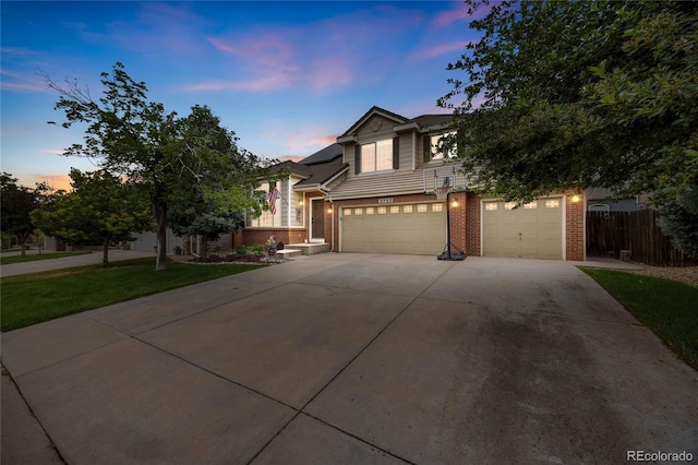 2753 E 139th Dr, Thornton, CO 80602 - view of front of property with brick siding, driveway, and an attached garage